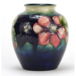 Moorcroft pottery vase hand painted with flowers, part label, painted and impressed marks to the