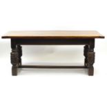 Oak refectory table with carved cup and cover bulbous legs united by a H stretcher, 73cm H x 184cm W