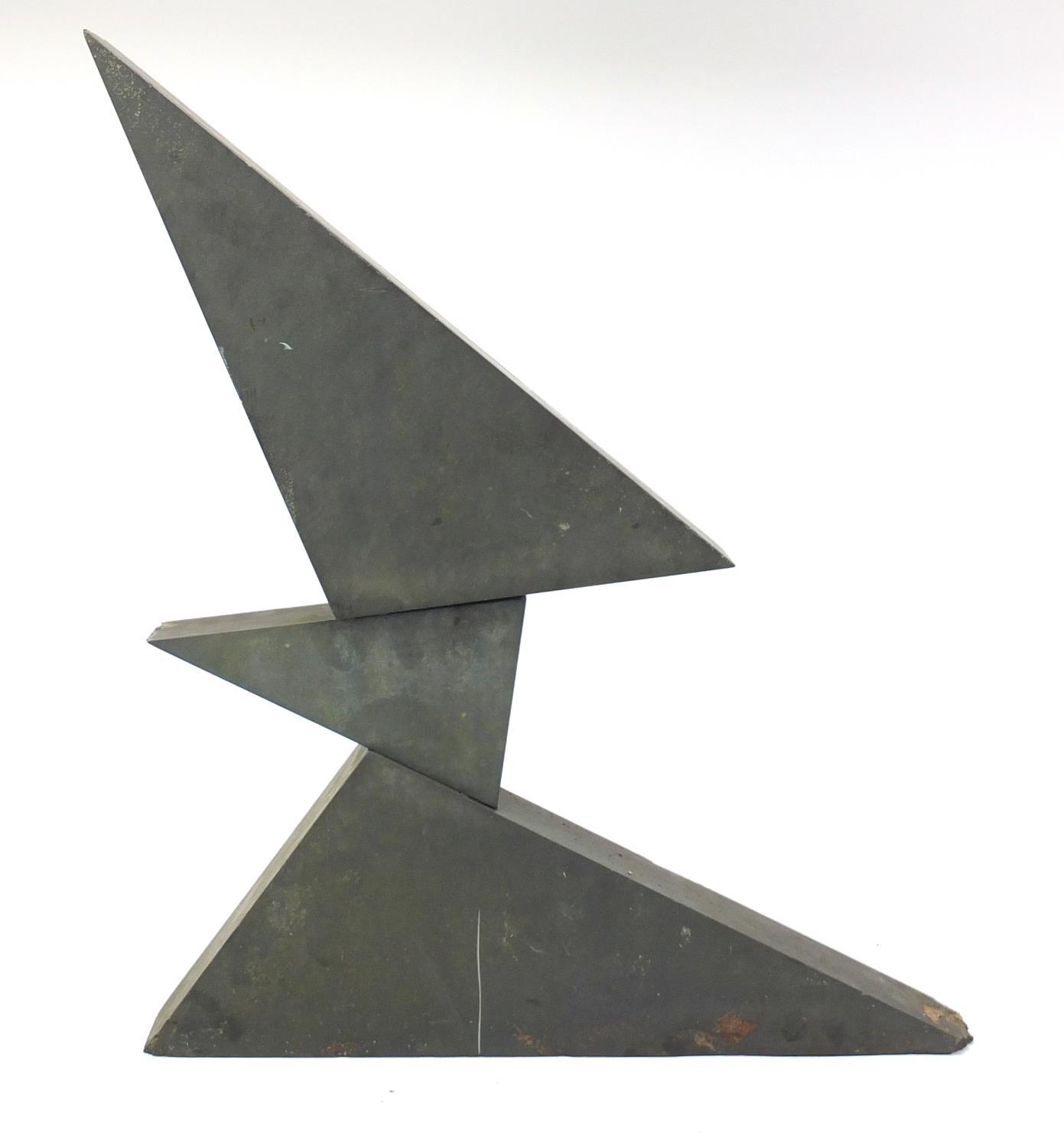 1970's carved black slate three piece sculpture by Victor Anton, 61cm high (PROVENANCE: Given
