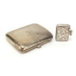 Rectangular silver cigarette case and a Victorian silver vesta, Birmingham hallmarks, the
