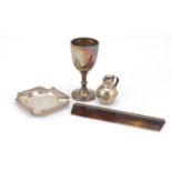 Victorian and later silver items comprising a trophy, miniature Jersey cream can, ashtray and silver