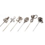 Six Art Nouveau silver hat pins, various hallmarks, the largest 26.8cm in length :For Further