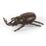 Japanese patinated bronze rhinoceros beetle, impressed marks to the underside, 6.5cm in length :