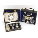 Two travelling holy communion sets, one by William Beardsley, the glass bottles with silver lids,