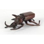 Japanese patinated bronze beetle with articulated wings, impressed marks to the underside, 10cm in