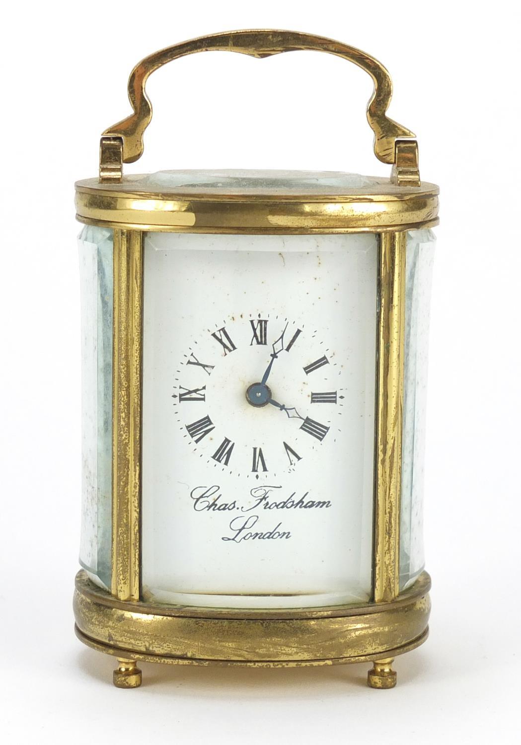Miniature brass cased oval carriage clock by Charles Frodsham of London