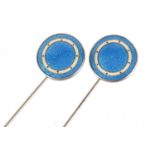 Pair of sterling silver and blue guilloche enamel hat pins, each 22.4cm in length :For Further