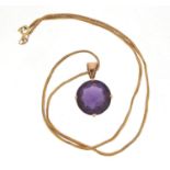 Unmarked gold blue/purple stone pendant, possibly Alexandrite, on a 9ct gold necklace, 11.8g :For