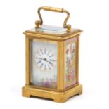 Gilt brass miniature carriage clock with Sevres style porcelain panels decorated with flowers,