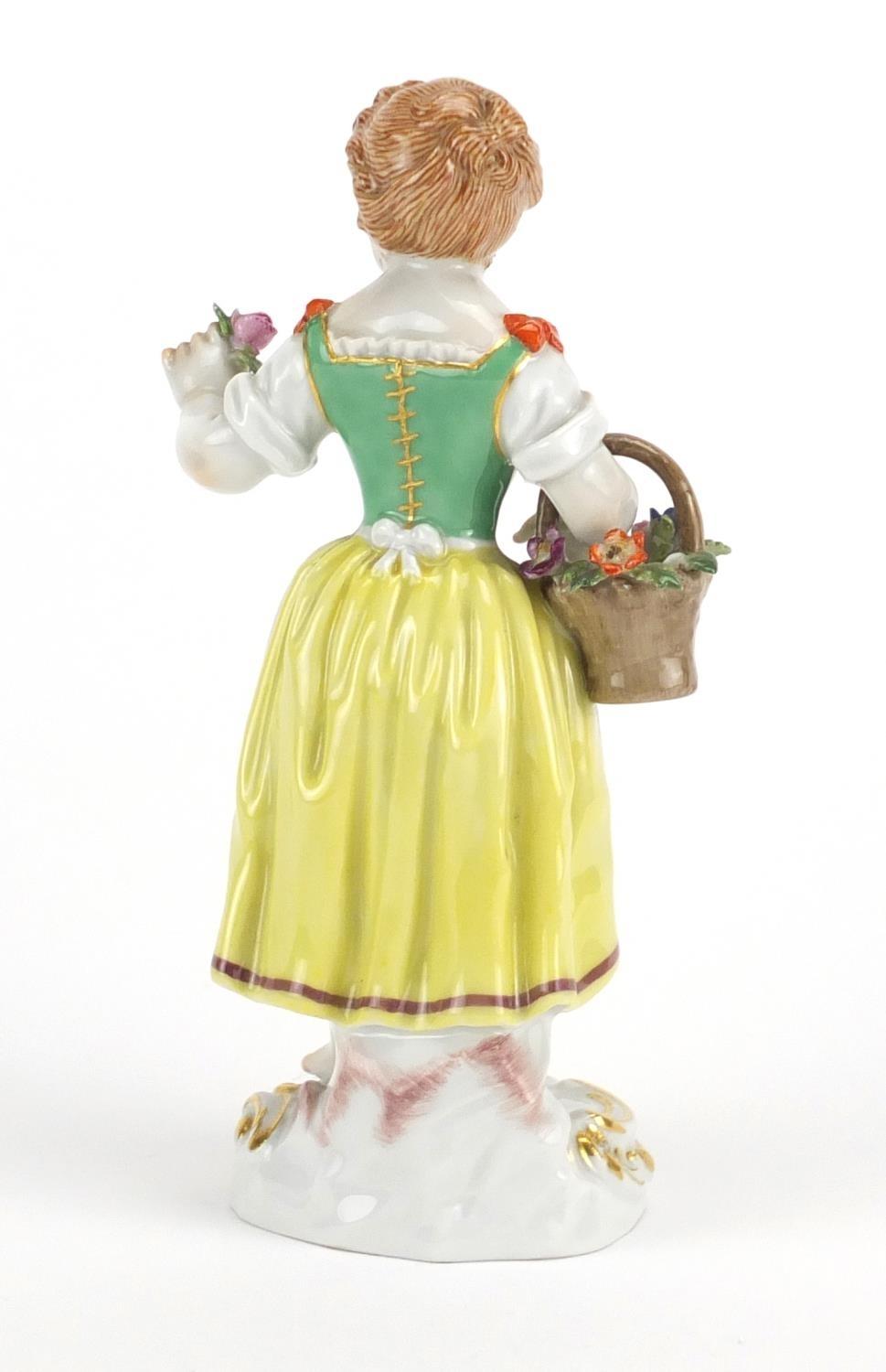 19th century Meissen porcelain figurine of a girl holding a basket of flowers, blue cross sword - Image 3 of 5