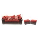 Contemporary brown leather and red fabric upholstered three seater settee, with two storage foot
