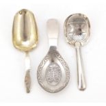 Three silver caddy spoons including one Russian and one Georgian, the largest 9.5cm in length, 28.8g