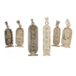 Six silver Egyptian hieroglyphic pendants, the largest 5cm in length, 23.6g :For Further Condition