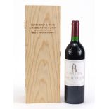 Bottle of 1988 Grand Vin de Chateau Latour Pauillac red wine with wooden crate