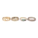 Four 9ct gold rings, including two eternity rings set with clear stones, various sizes, 8.5g :For