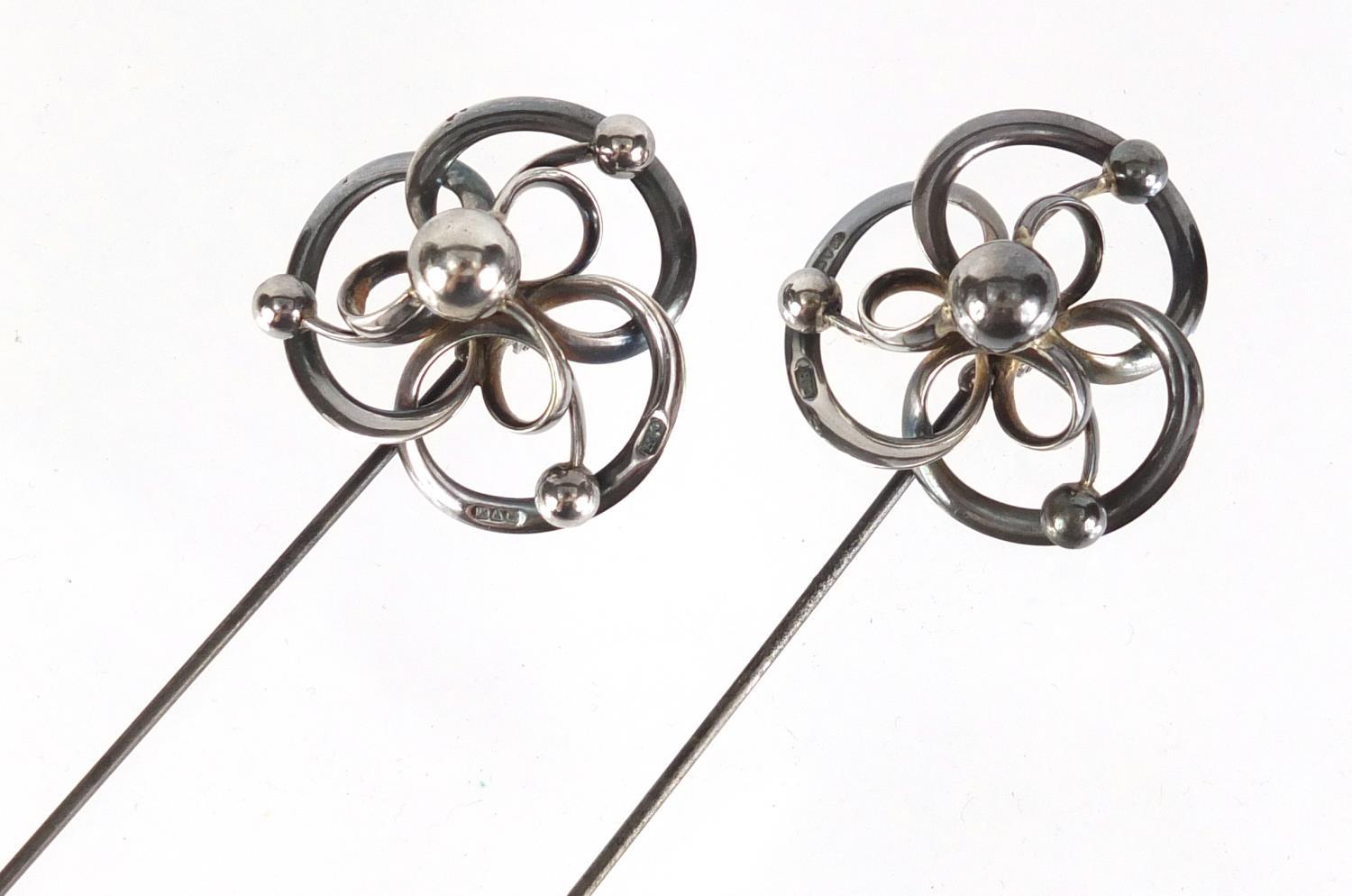 Pair of Art Nouveau silver hat pins by Charles Horner, Chester 1913, each 22cm in length :For