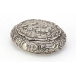 Continental silver tobacco box, the hinged lid embossed with a Roman gladiator on a chariot,