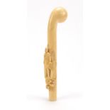 Good 19th century ivory walking stick handle finely carved in relief with a soldier in military