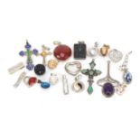 Mostly silver pendants including a Russian enamelled cross, some set with semi precious stones, 40.