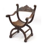 Italian oak savonarola chair carved with grotesque masks, 84cm high :For Further Condition Reports