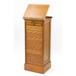 1920's oak filing cabinet with tambour front with easel top, 116cm H x 49cm W x 42cm D :For