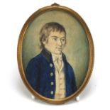 Georgian oval watercolour portrait miniature of a young gentleman housed in a brass mount, 11cm x