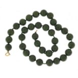 Chinese green jade bead necklace with 18ct gold clasp, 46cm in length :For Further Condition Reports