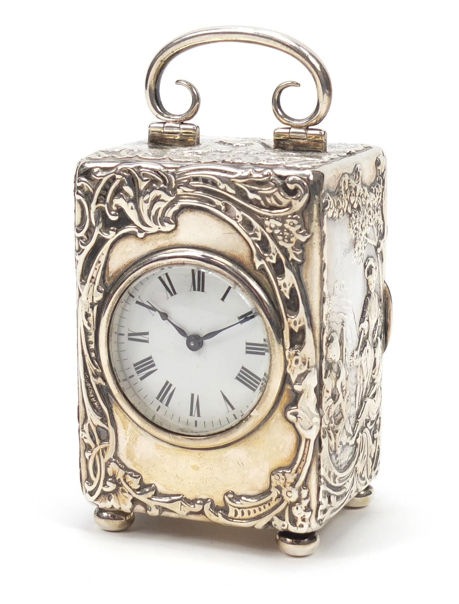 Victorian silver cased carriage clock by William Comyns, embossed with ...