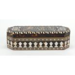Islamic tortoiseshell, ivory and mother of pearl box with canted corners, the hinged lid decorated