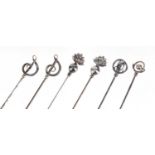 Six silver hat pins including a pair by Charles Horner, the largest 17cm in length :For Further