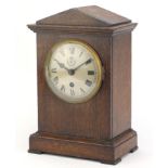 British military World War II RAF Officer's mess clock housed in an oak case, the movement stamped