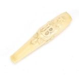 Victorian carved ivory cigarette holder housed in a tooled leather velvet lined case, 11cm in length