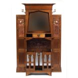 Arts & Crafts oak hall stand with bevelled mirror and copper inserts to each wing, remnants of the