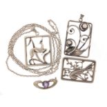 Three Danish silver pendants and brooches and an Art Nouveau amethyst brooch by Charles Horner,