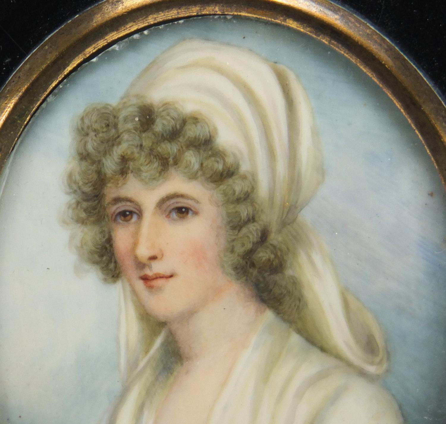 19th Century oval hand painted portrait miniature of a young female, housed in an ebonised frame, - Image 2 of 4