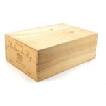 Twelve bottles of 2000 Chateau Rollan de By, Medoc red wine housed in a sealed crate :For Further