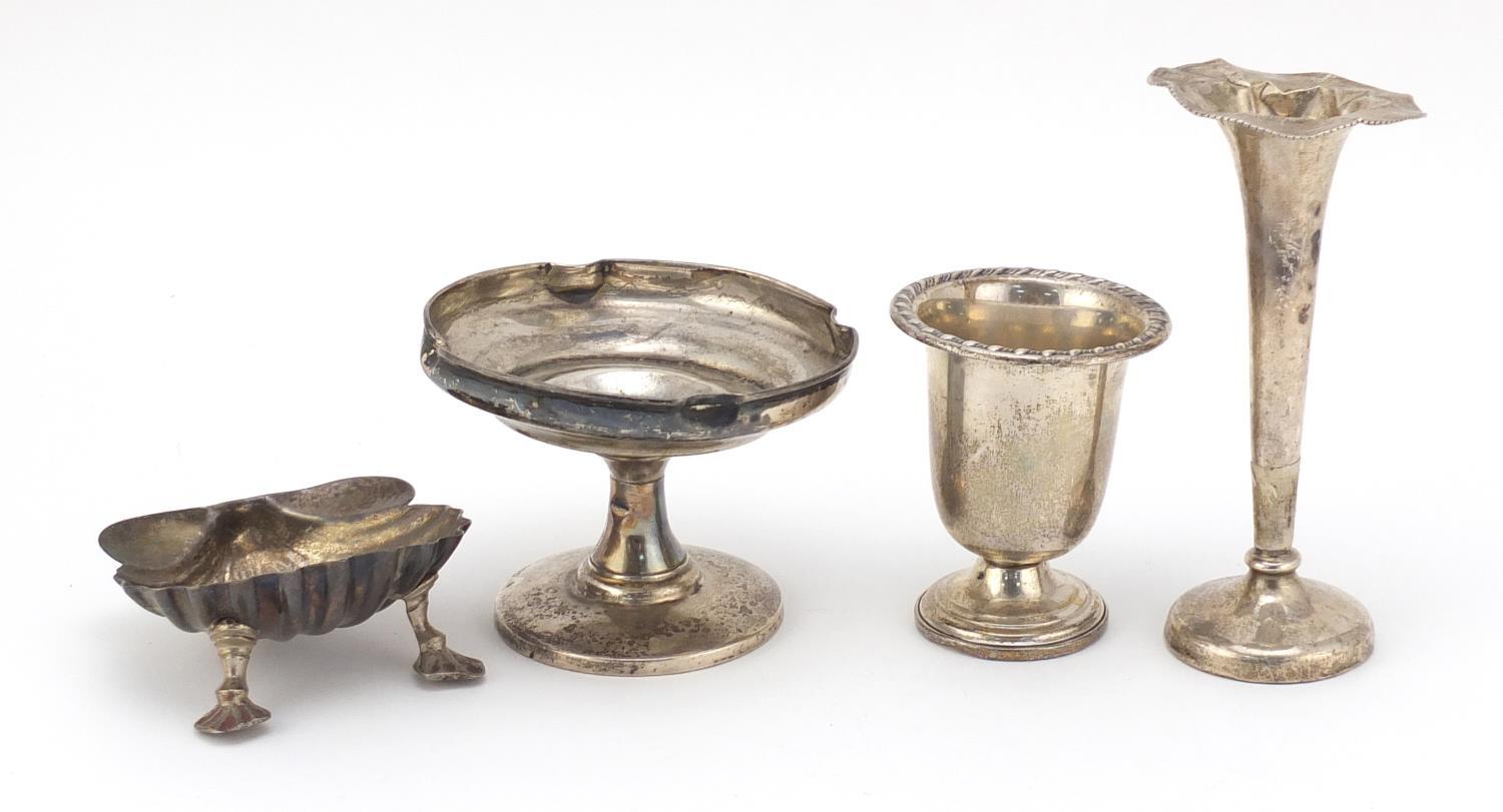 Silver items comprising two vases, a pedestal bonbon dish and a Victorian shell shaped open salt,
