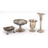 Silver items comprising two vases, a pedestal bonbon dish and a Victorian shell shaped open salt,