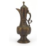 Islamic engraved gilt copper water pot engraved with flowers, 37.5cm high :For Further Condition