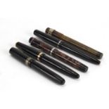 Five fountain pens including Parker Duofold and Waterman's, one with 14K gold nib :For Further