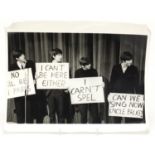 Vintage black and white photograph of the Beatles standing on stage, 30.5cm x 23.5cm :For Further