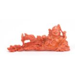 Good Chinese coral carving of a Buddha with three children, 11cm wide :For Further Condition Reports