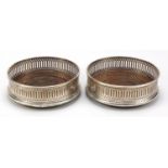 Pair of circular silver and oak wine coasters, hallmarked London, 1986, 12.5cm in diameter :For