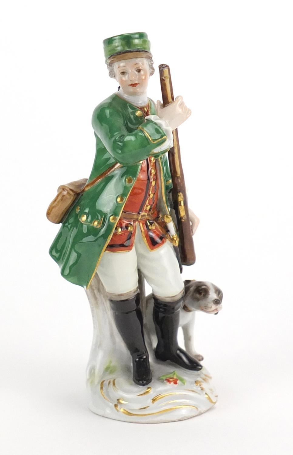 19th century Meissen porcelain figure of a huntress with a dog, blue cross sword marks to the