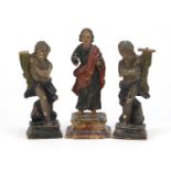 Three 18th century polychrome painted carved wood figures 16.5cm high :For Further Condition Reports