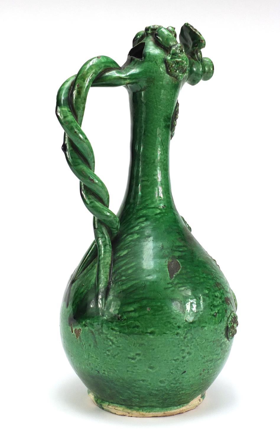 Turkish Canakkale green glazed pottery ewer with applied flower heads, 39cm high :For Further - Image 5 of 6