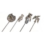 Four rotating silver hat pins including two teddy bears and a dog head, one by Adie & Lovekin Ltd