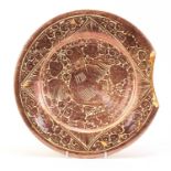 Persian lustre pottery plate hand painted with mythical bird, Christies label verso, 31cm in