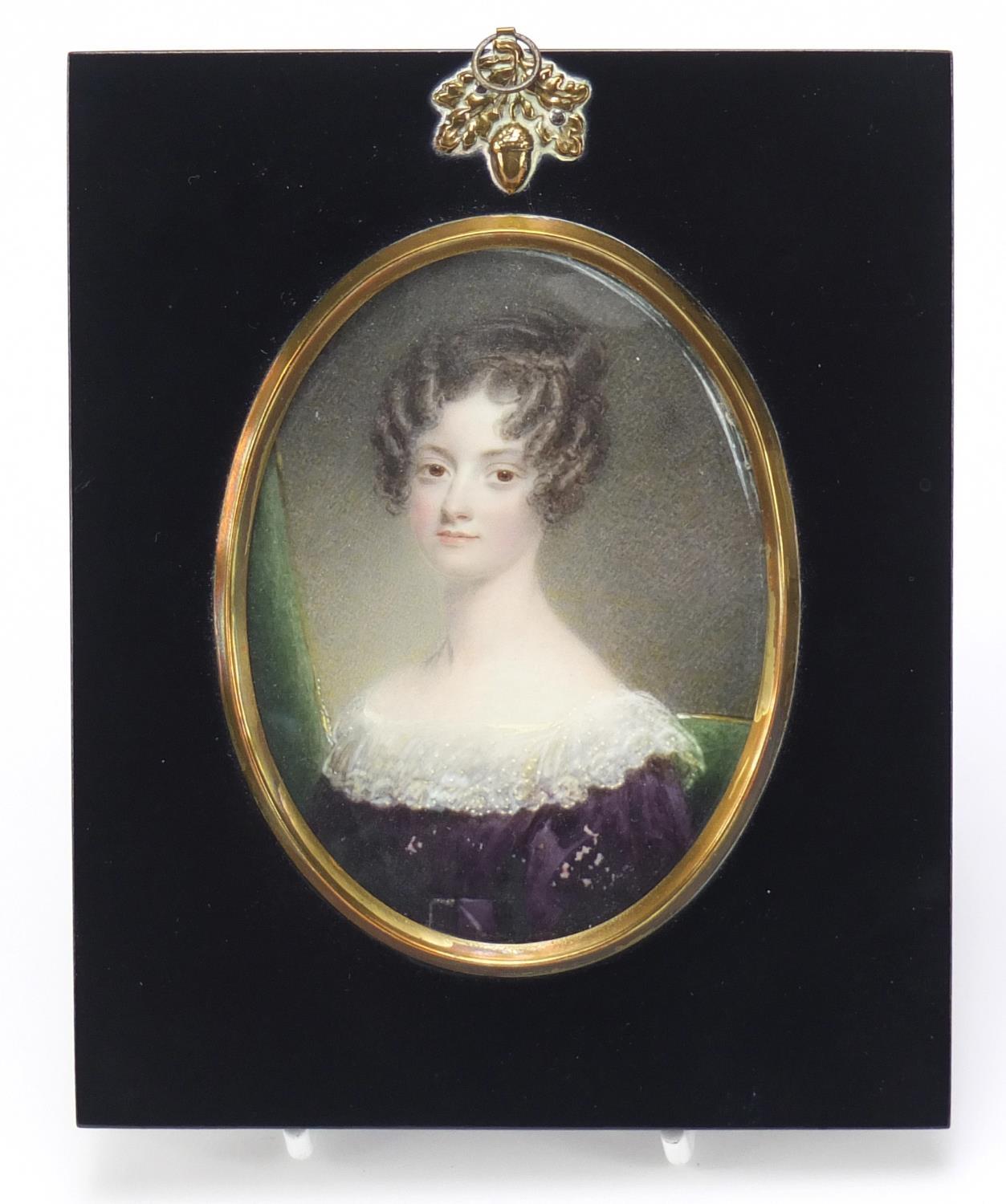 19th century oval hand painted portrait miniature of a young female, housed in an ebonised frame,