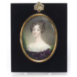 19th century oval hand painted portrait miniature of a young female, housed in an ebonised frame,